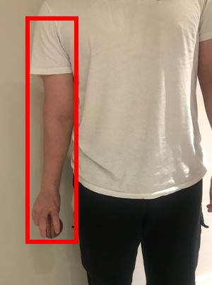 Photo showing the bowling arm locked at the side of the body