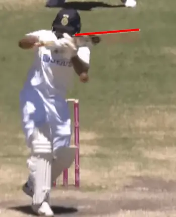 A photo of a cricketer demonstrating a top edge