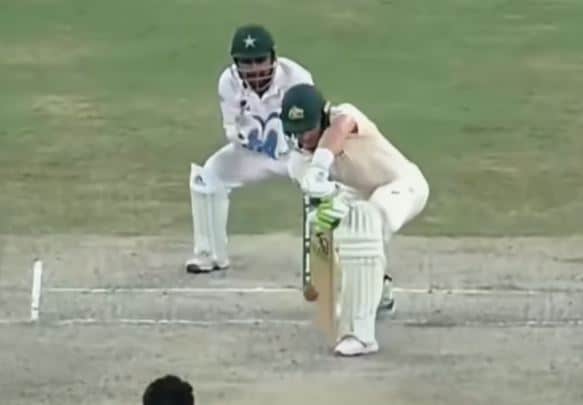 Tim Paine playing the forward defence with bat and pad close together